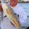Richard Yoder of Cypress TX fished a live croaker to snatch up this 28 inch slot red