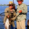 Rose Walrath of Goodrich TX landed her husband's nice slot red he caught on a finger mullet, then released it