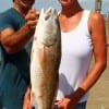 Sharon and Richard Borne of Dallas teamed up to catch this 25 inch slot red on a finger mullet-- all I did was net it, stated the hubby