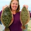 Terrie Riley of San Antonio TX drove all the way here to catch these two flounder on finger mullet