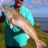 This 38 inch redfish pulled the rod out of my hands- stated Mike Godfrey of League City, so I dove into the pass to retrieve my fishing rod AND the redfish