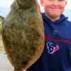 Twelve yr old Joshua Wallace of Houston fished a live shrimp when this 26 inch-6.5 lb Mega-Flounder hit his bait