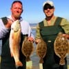Wade-Buddies David Roy of Anahauc and Steven Kyte of Houston waded rollover bay with finger mullet and Berkley Gulp for these flounder and recfish