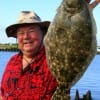 Bill Andrews of Alvin TX shows but one of his Nov-limit of flounder he caught on mud minnows