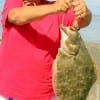 Bobbie West of Gilchrist TX hooked and landed this 23 inch Doormat Flounder while fishing a finger mullet