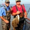 Father and son waders Todd and Paul Wiley of Terrell TX worked Rollover bay with Berkley gulp for these nice flounder