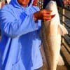 Jean Bostic of Houston fished shrimp to catch this nice 23 inch slot red