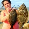 Jessica Apple of Houston hefts these nice flounder caught on finger mullet