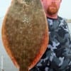 Jimmy Staples of Magnolia TX was fishing a Berkley Silver blue shrimp when this 22 inch Doormat Flounder hit the Gulp