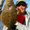 Looking much like a Bandito, Winnie TX anglerette Barbara Singleton tethered up this 19 inch flatfish she took on a Berkley Gulp