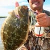 Lucio Villanueva of Hithcock TX wrangled up this nice 16 inch flounder while fishing Berkley Gulp