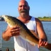 Port Neches TX angler John Vidalick nabbed this nice slot red while fishing a finger mullet