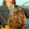 Ronnie Hennis of Oak Island TX wade-fished Rollover Bay with Saltwater Assasins to nail this Nov-limit of flounder
