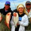 TJ Tanner with Savanna and Shawn Ware of Longview TX nabbed these nice reds and flounder on finger mullet