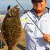 Thien Tram of Houston nabbed this 20 inch flounder while fishing Berkley Gulp