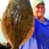 Tony Mazzola of Hamshire TX holds his 22 inch doormat flounder he took on a Berkley Gulp