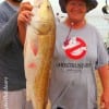 When he heard Janice Hosea scream, Bryan Waddell came to her aid to net her first Redfish EVER, a 37 inch Bull Red caught on a finger mullet