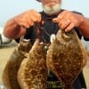 Captain Jack of Gilchrist TX shows off these nice flounder caught on Berkley Gulp