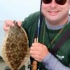 College Station TX angler Mike Parr waded Rollover Bay with Berkley Gulp to snatch up this nice keeper flounder