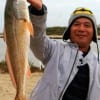 Jaing King Lou of Houston took this 22 inch slot red while fishing a finger mullet