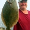 James Simon of Huntsville TX caught this nice flounder on a mud minnow