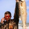 Dayton TX angler Orae Laird surf fished with squid to catch, land, and tag this 40 inch Mega Bull Red