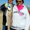Galveston anglers Vicky and Ken Forgrave heft Vicky's 24 inch slot red she caught on live shrimp