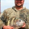 Rene Retinos of Houston hefts this nice sheepshead caught on a c.a.s.t.