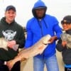 Fishin Buds Andre and Christina Wright along with Chris heft their drum and redfish they caught on shrimp