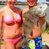 Fishin Buds Juan Contero and Katy Avery of Pasadena TX show off this nice drum caught and released on shrimp