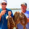 Flounder pounders Tom Oliver and George Bryan rubbed Berkley Gulps together to come up with these nice flounder