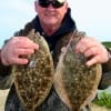 Jiggin the bulkhead with chartruce Gulp put these nice flounder in the box for Michael Keen of Silsbee TX