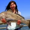 Nicole Li of Houston hefts this nice 33 inch Bull Drum caught and released on shrimp