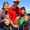 The Morgan Family of the Woodlands TX show off 8 yr old Ellie's flounder she caught on live shrimp