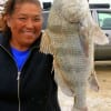 Alicia Amamya of Houston fished a teeny teeny hook with a teeny teeny shrimp to catch this BIG keeper drum