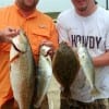 David Rowe of Cypress and Jerrod Horton of Dallas took this Rollover Slam of trout, reds, and flounder while fishing finger mullet