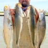 Donnie Lucier of Winnie TX shows off 4 of his 8 trout he caught and released while fishing soft plastics