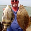 Ed Worthey of Richmond TX hefts this sheepshead and flounder caught on shrimp