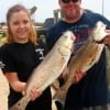 Father and Daughter fishing team- Miller and Alyson Jenkins of Jacksonville TX took these 25 and 26inch slot reds on live shrimp