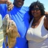 Former Marine Turon McCoy with wife Valeri tethered up these drum and whiting while fishing shrimp