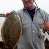 McCurdy of Crystal Beach TX shows off one his 4 flounder he took on live shrimp