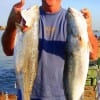 Mike Keene of Silsbee TX hefts these nice specks caught on a T-28