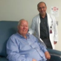 Ted Henley and Dr. Mohsen Ghadimi-Mahani during one of Ted’s chemotherapy treatments at UTMB.