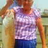 Carol and Jerry Mathis show off Carol's nice 30inch tagger bull red she caught on shrimp