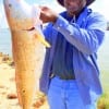Claude Thomas of Houston wrangled up this HUGE 36inch tagger Bull Red while fishing live shrimp