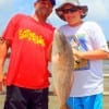 Father and son - the Wicox family of Huffman TX show off their 27inch slot red caught on shrimp