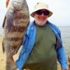 John S Zelog of Hookset New Hampshire hefts this nice keeper Drum caught on shrimp