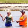 Mother and daughter learning the basics of wade-fishing Rollover Bay