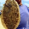 Pete Sheppard of Houston showing off his -Guess The Weight- flounder he caught on a finger mullet