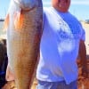 Vernie Valero of Abilene TX fished live shrimp to take this really nice 28inch slot red